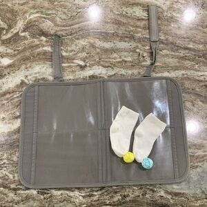 Lovevery travel card case and bell socks
